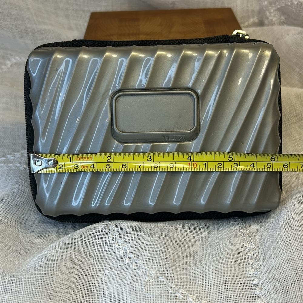 Tumi hard case luggage cosmetic bag filled with goodies for your next trip - Picture 4 of 10